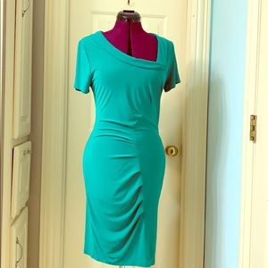 Green knit form-fitting dress.